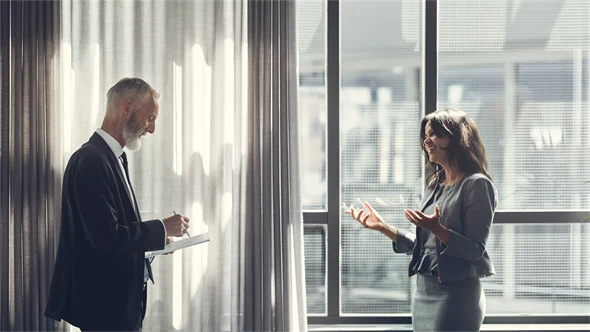 Man and woman standing talking